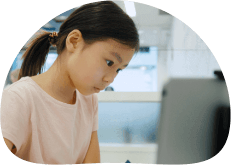 Young apprentice working at a laptop